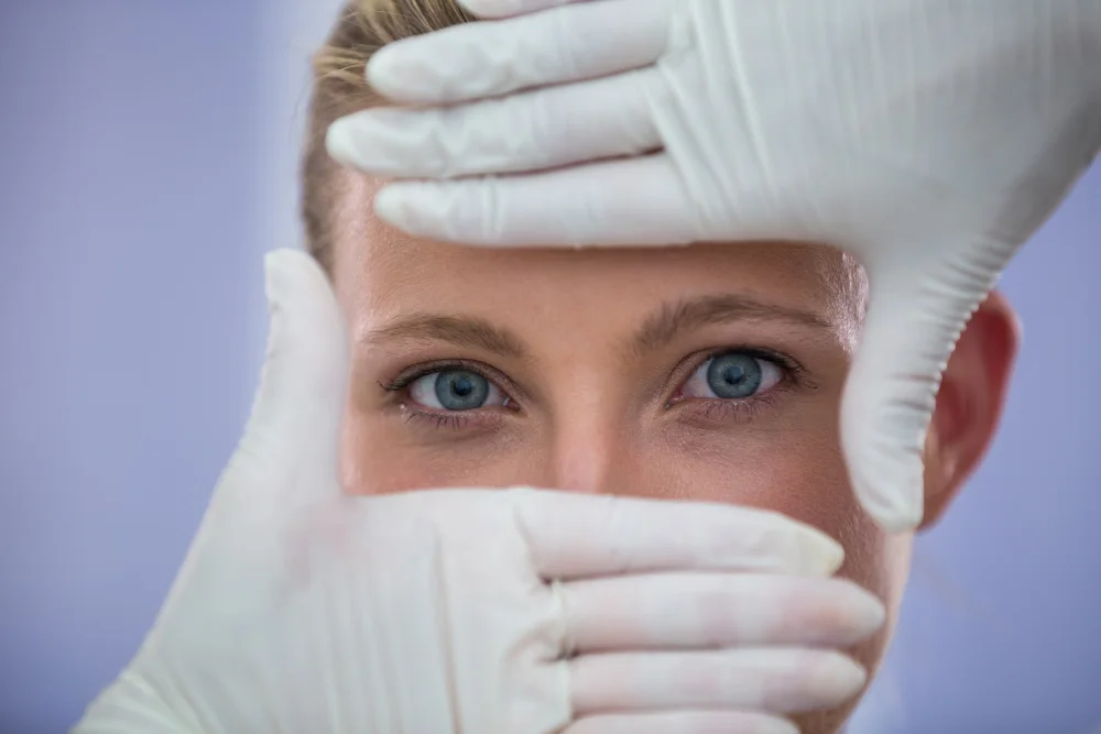 Clinician assessing the under-eye area during consultation