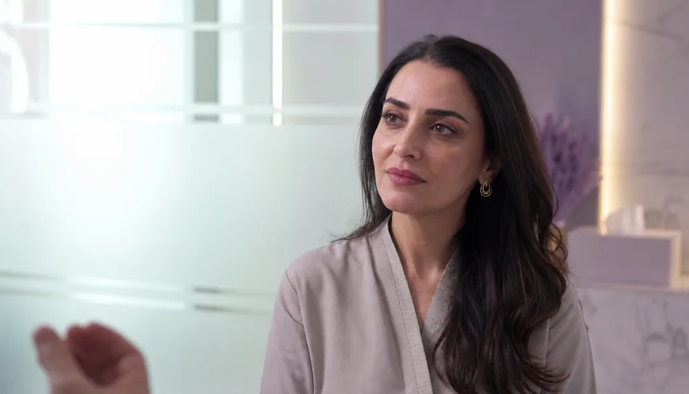 Illustrative under-eye exosome consultation portrait in a Dubai aesthetic clinic