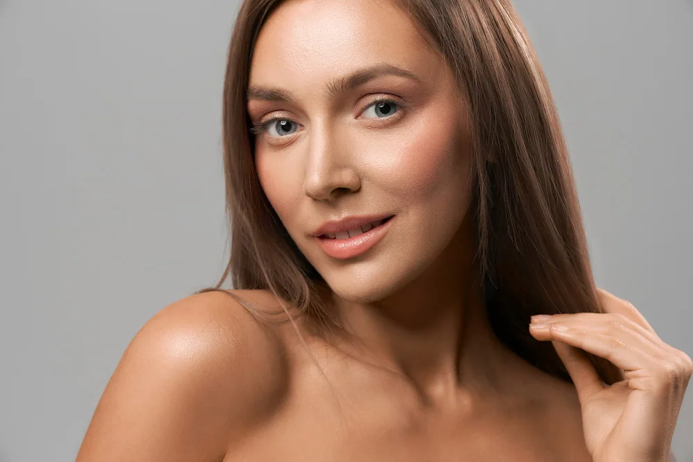 Smiling beauty portrait showing the nasolabial fold area