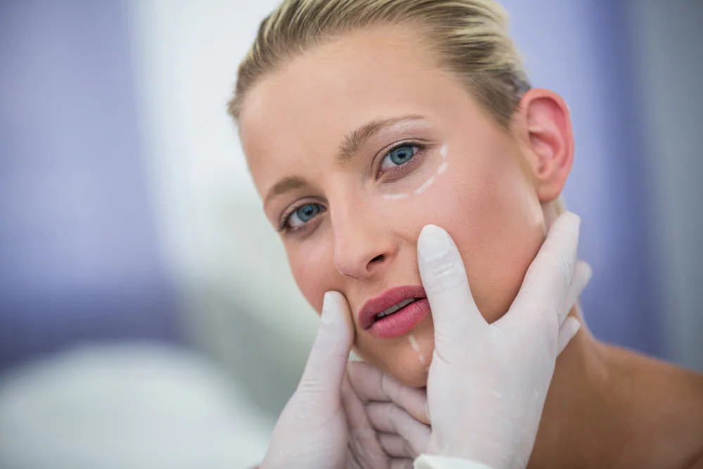 Clinician assessing the jaw and lower face before masseter Botox
