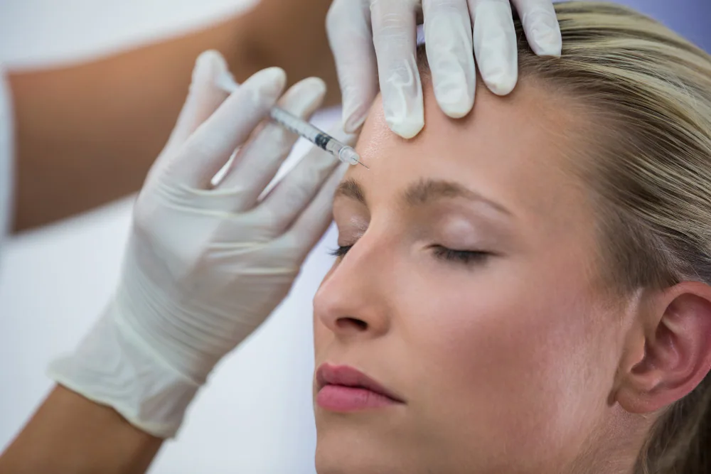Upper-face botulinum-toxin treatment near the forehead