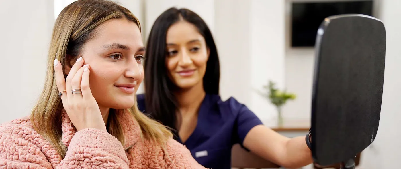 Patient reviewing her treatment result with a clinician